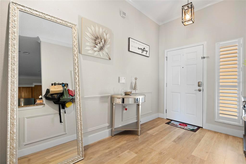 1461 Ridge Terrace Tarpon Springs, FL 34689 - Photo 14 of 25 a view of a hallway to closet and wooden floor