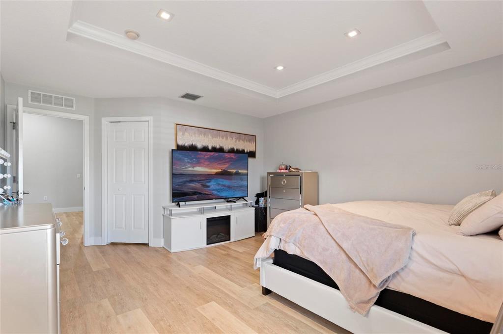 1461 Ridge Terrace Tarpon Springs, FL 34689 - Photo 16 of 25 a bedroom with a bed and a flat screen tv