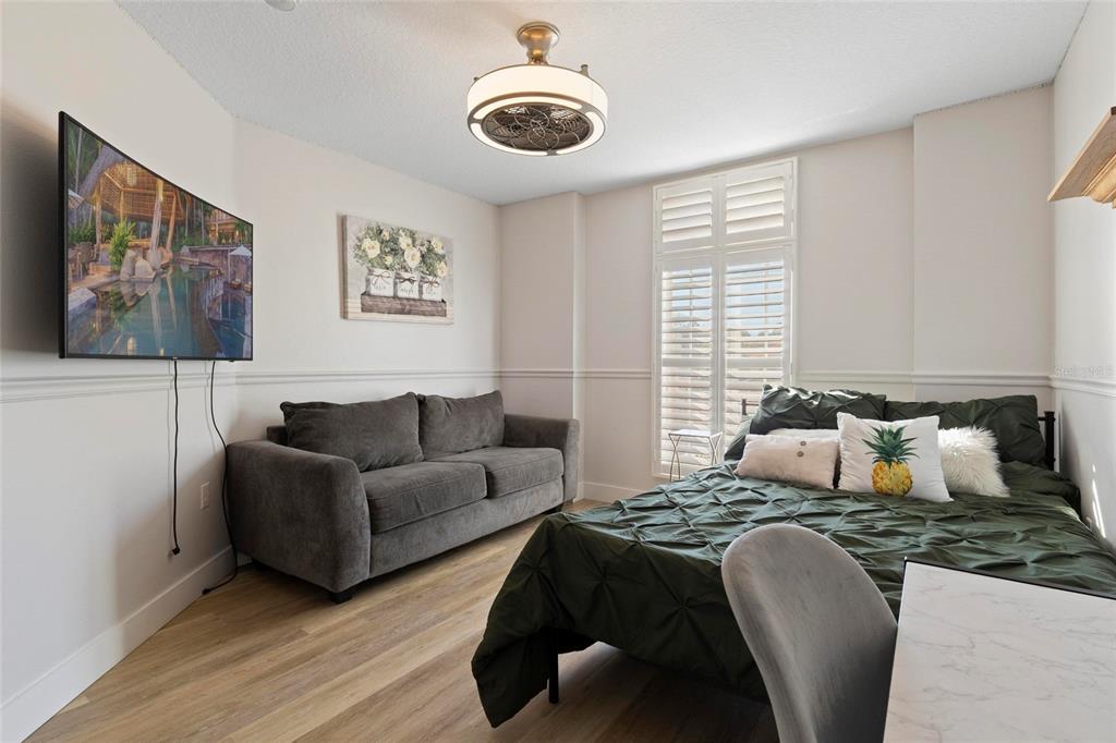 1461 Ridge Terrace Tarpon Springs, FL 34689 - Photo 25 of 25 a bedroom with furniture and a large window