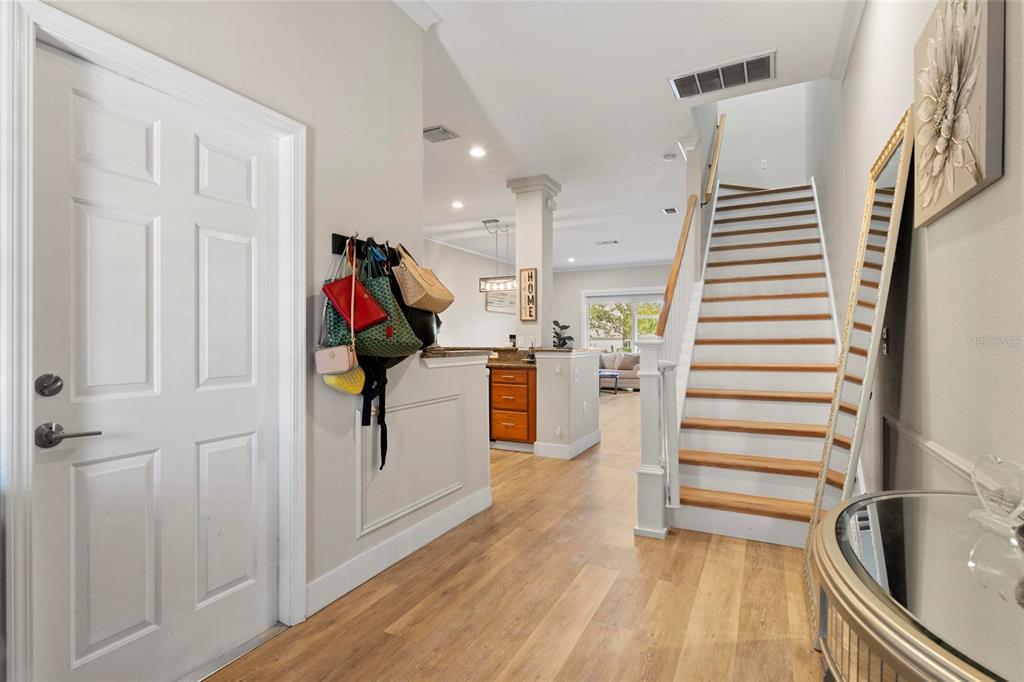 1461 Ridge Terrace Tarpon Springs, FL 34689 - Photo 5 of 25 a view of entryway and hall with wooden floor