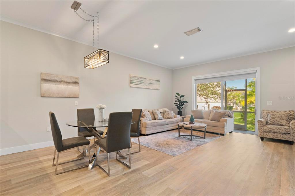 1461 Ridge Terrace Tarpon Springs, FL 34689 - Photo 9 of 25 a living room with furniture and a wooden floor