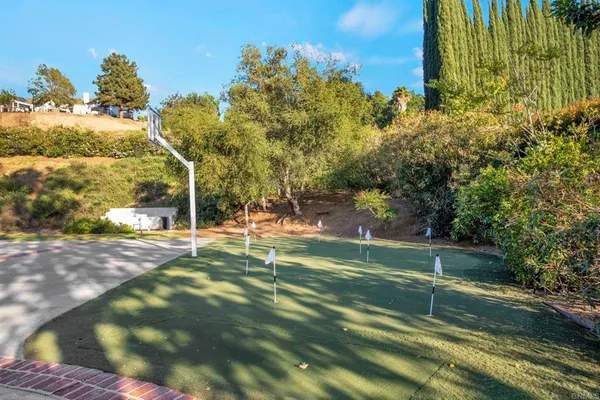 a view of a swimming pool with a patio
