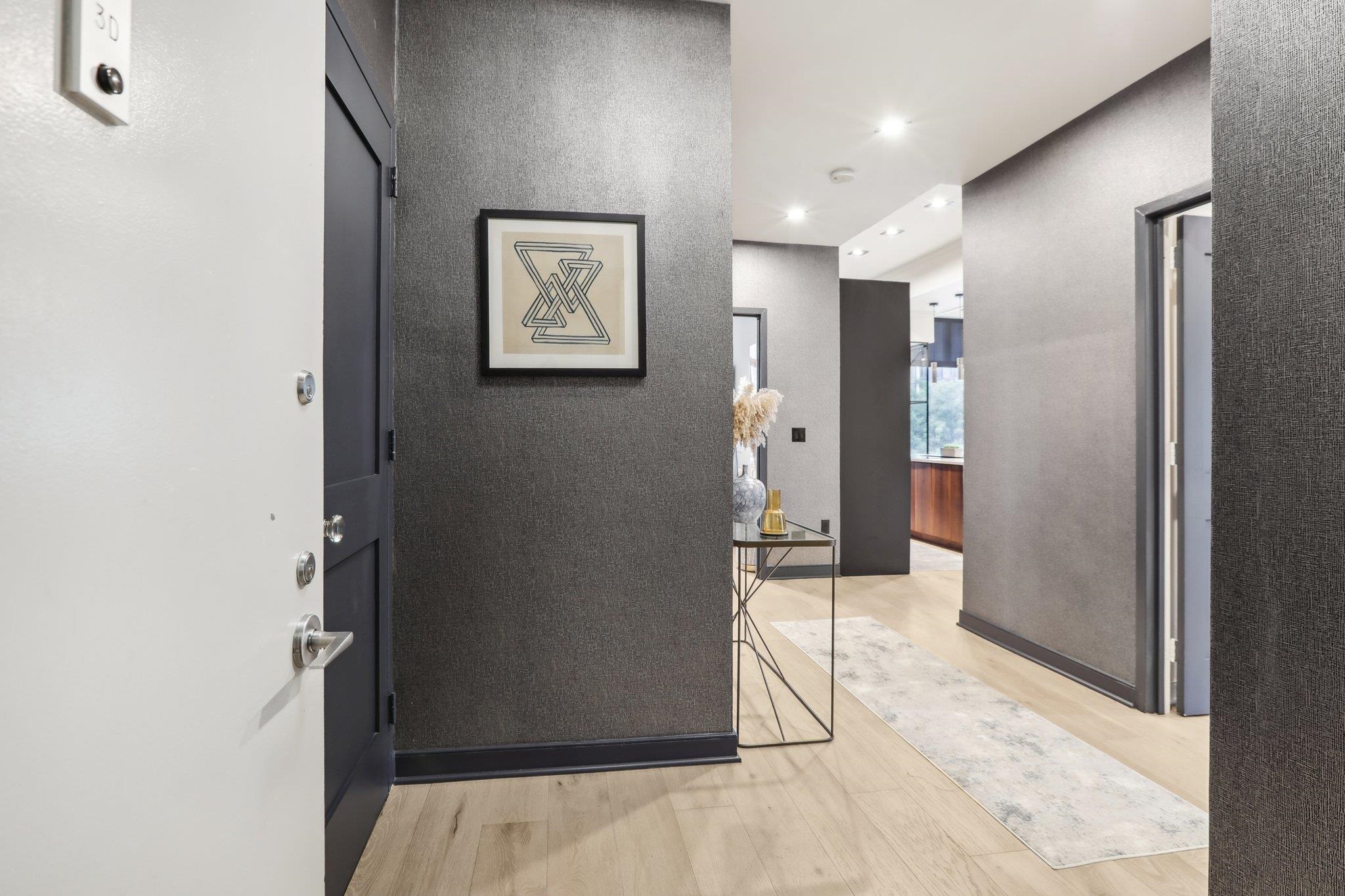 1500 Washington Street, Unit 3D Hoboken, NJ 07030 - Photo 2 of 23 a view of a hallway with wooden shelves