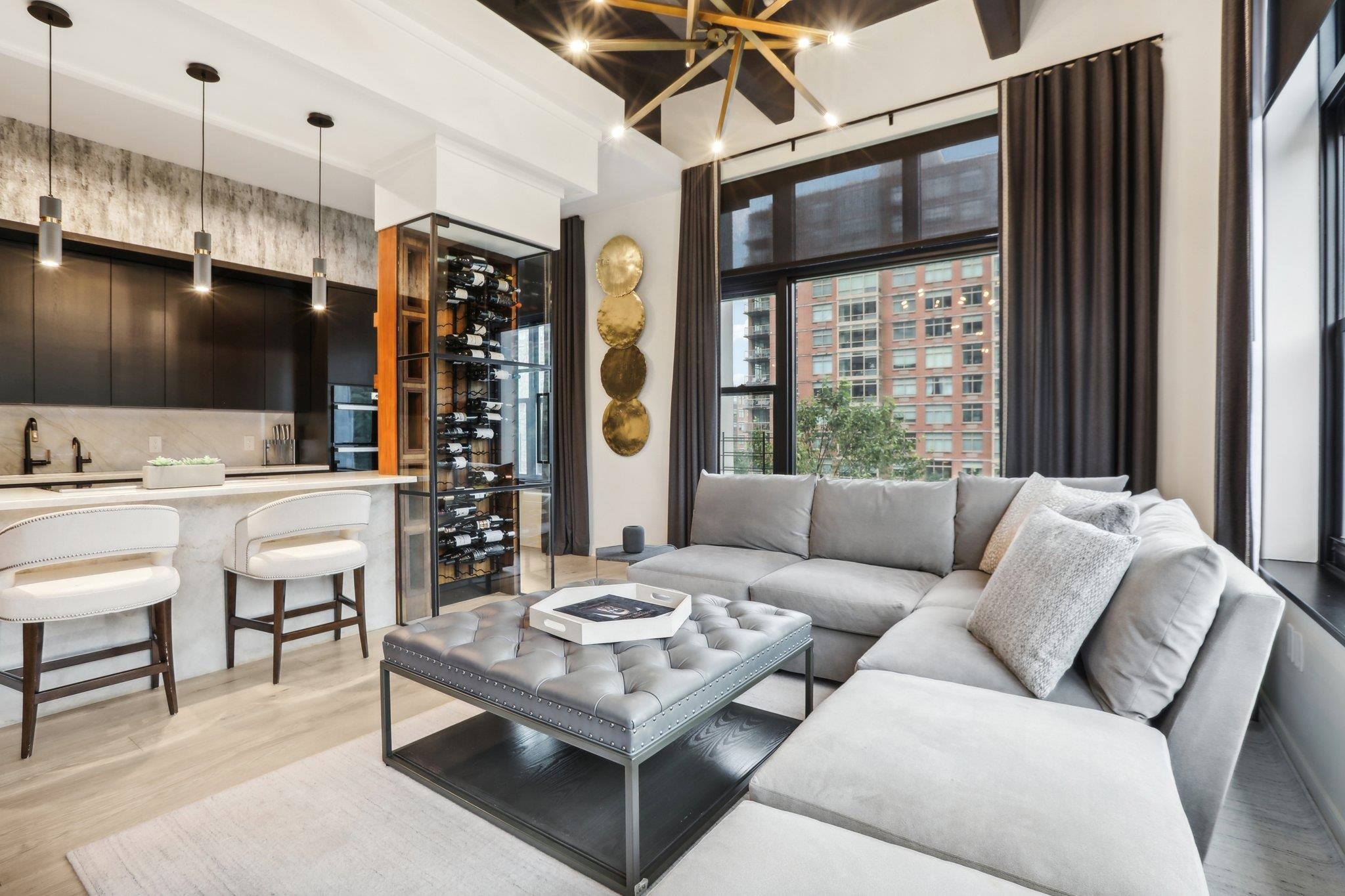 1500 Washington Street, Unit 3D Hoboken, NJ 07030 - Photo 4 of 23 a living room with furniture a flat screen tv and a large window