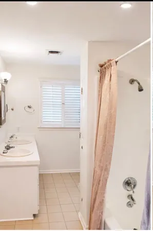 a bathroom with a sink a vanity and a mirror