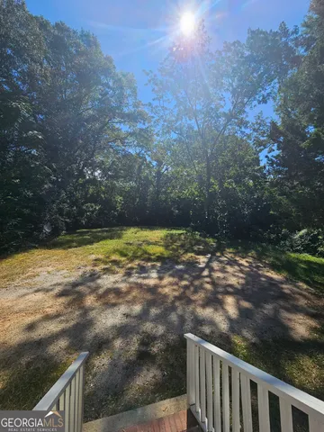 a view of a yard with an outdoor space