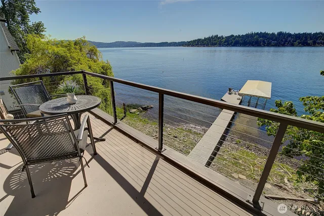 a view of a balcony with chairs