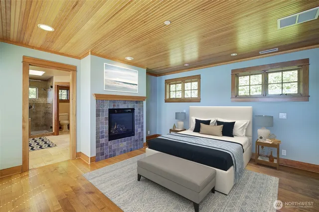 a bedroom with a bed and a fireplace