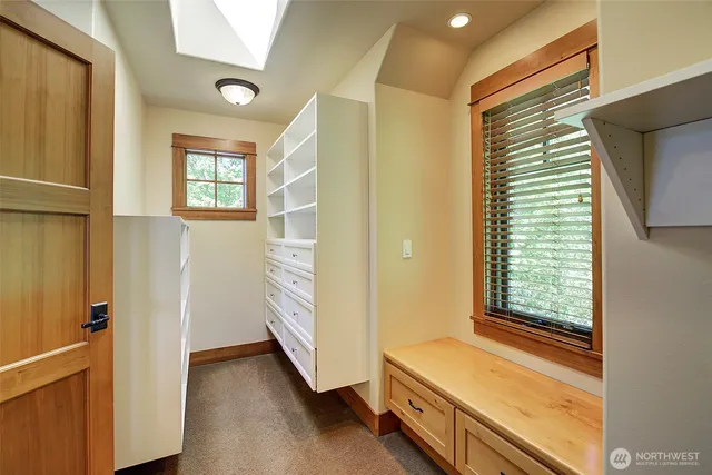 a bathroom with a tub and a window