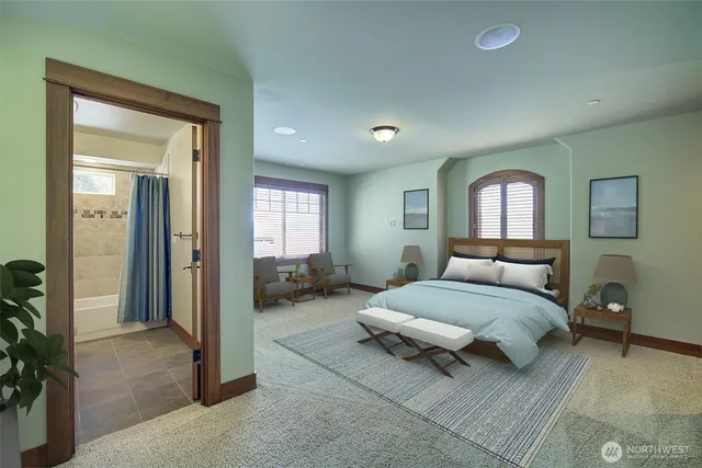 a spacious bedroom with a bed and a mirror