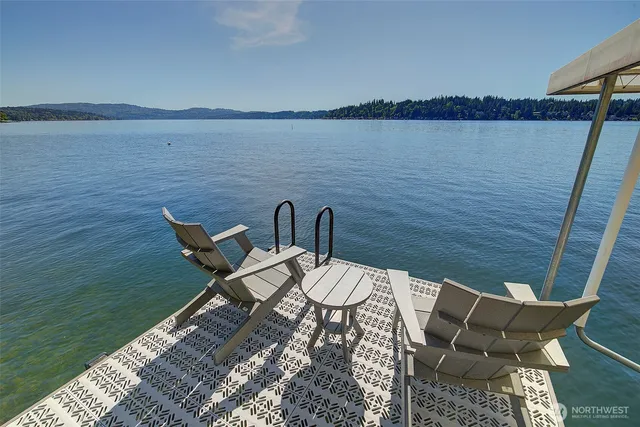 a view of a sink and washer in a kitchen