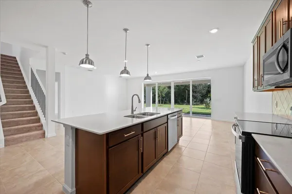 a kitchen with sink cabinets and window