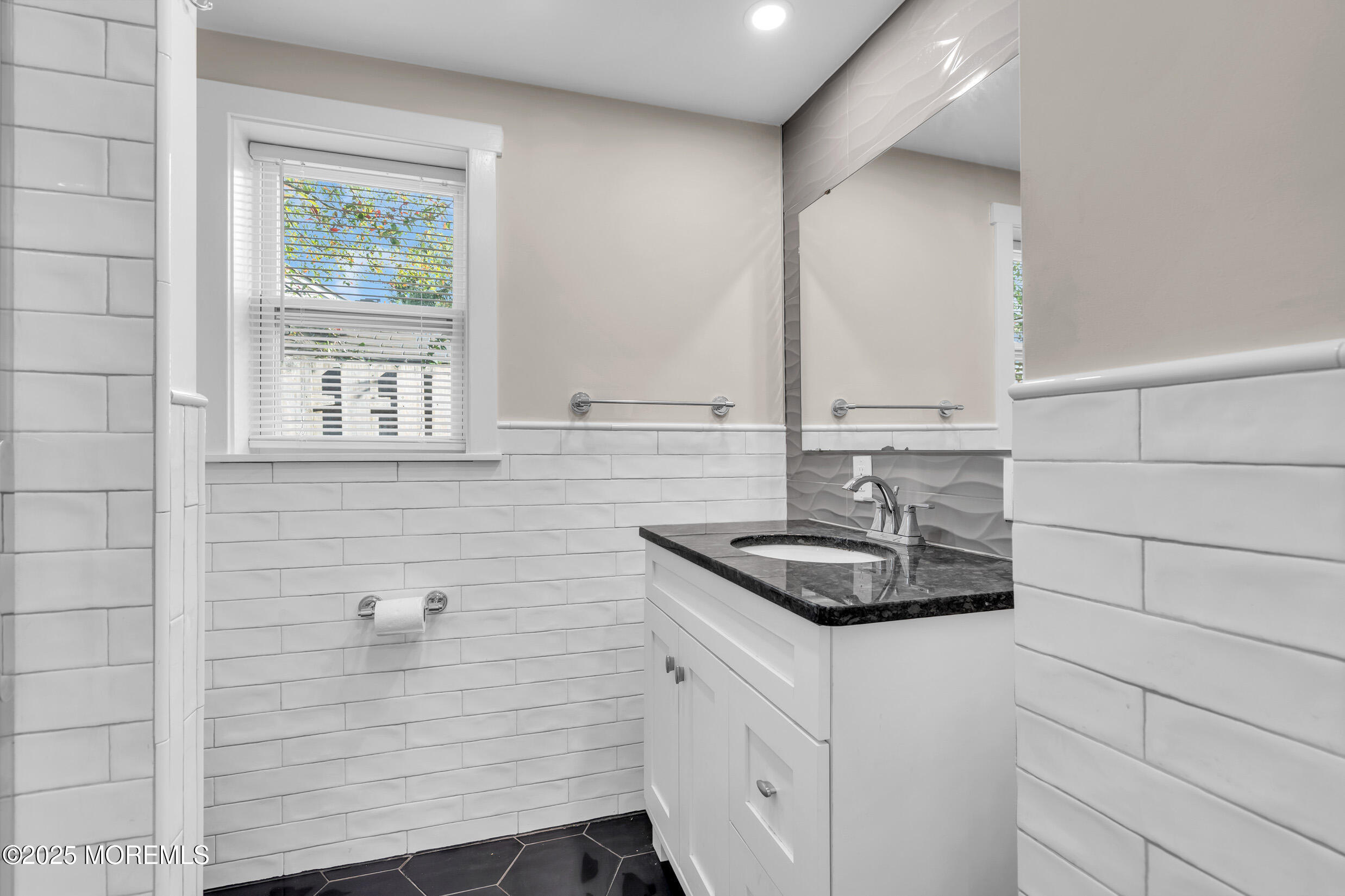 4 Pine Bluff Road Toms River, NJ 08753 - Photo 19 of 39 a bathroom with a sink and a window
