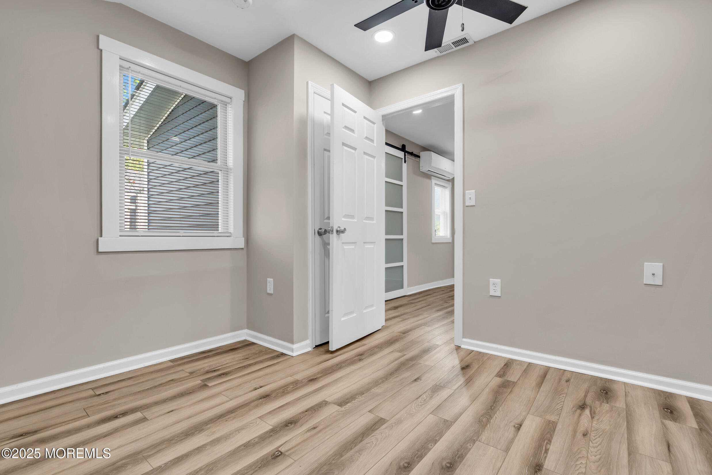 4 Pine Bluff Road Toms River, NJ 08753 - Photo 23 of 39 a view of an empty room with wooden floor and a window