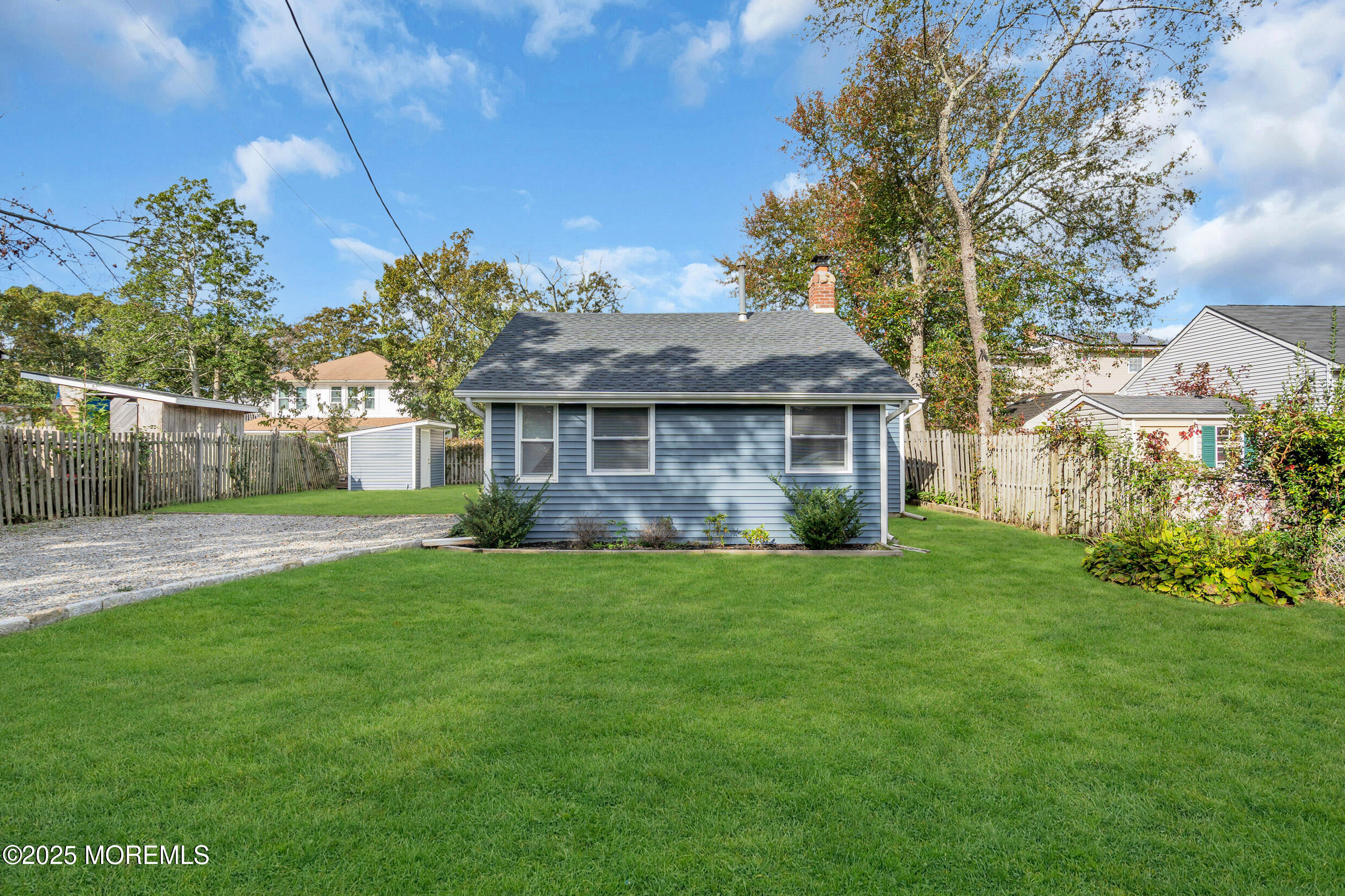 4 Pine Bluff Road Toms River, NJ 08753 - Photo 38 of 39 a front view of a house with a garden