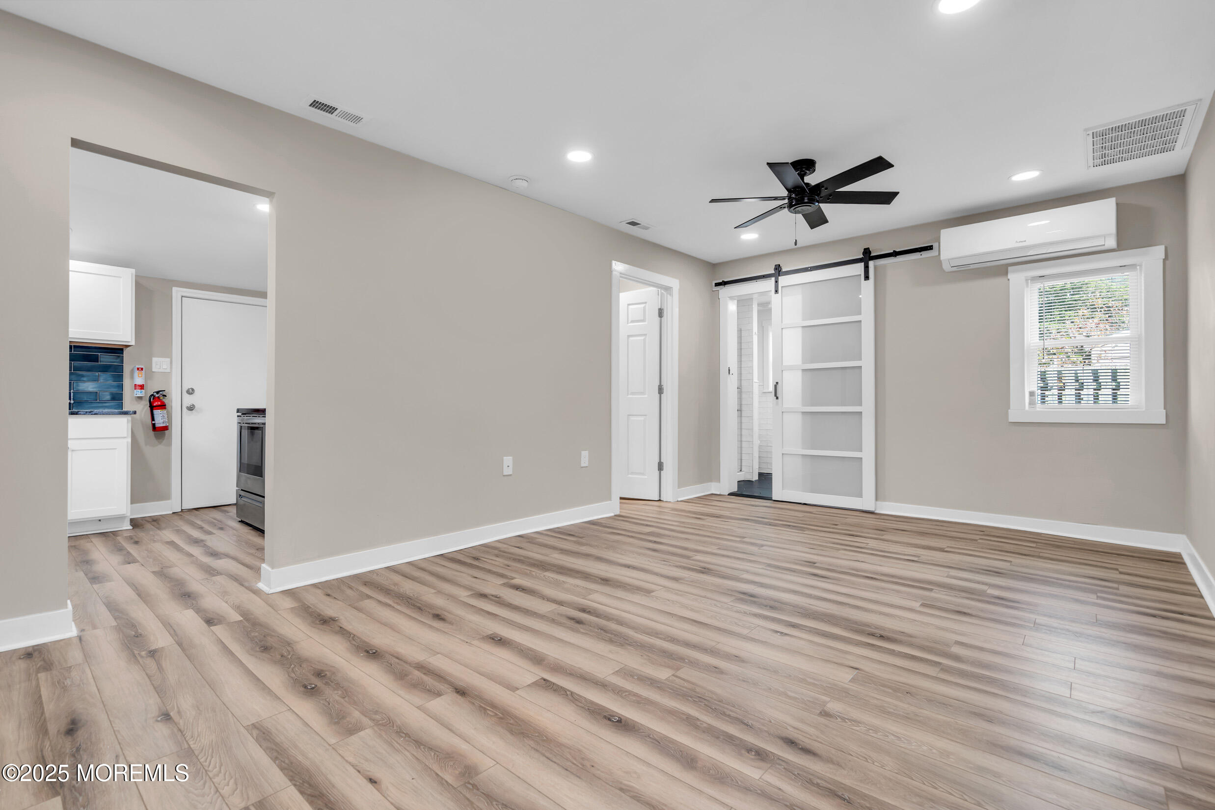 4 Pine Bluff Road Toms River, NJ 08753 - Photo 9 of 39 a view of empty room with wooden floor and ceiling fan