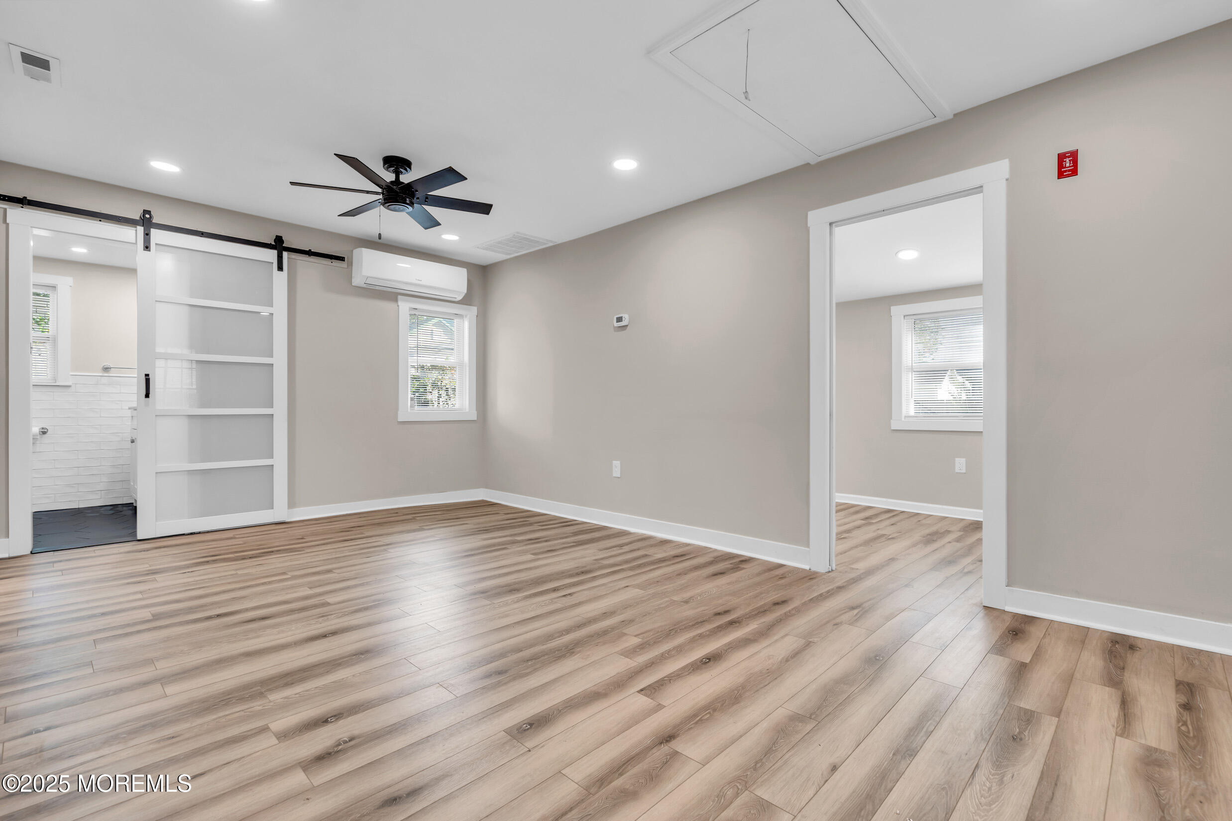4 Pine Bluff Road Toms River, NJ 08753 - Photo 10 of 39 wooden floor in an empty room with a window