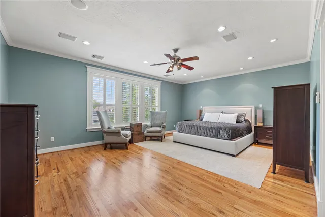 a living room with furniture and a book shelf