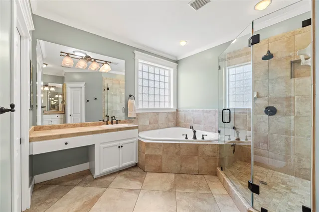 a living room with furniture and large windows