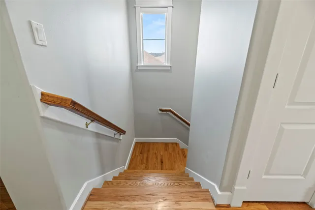 a bathroom with a double vanity sink and mirror