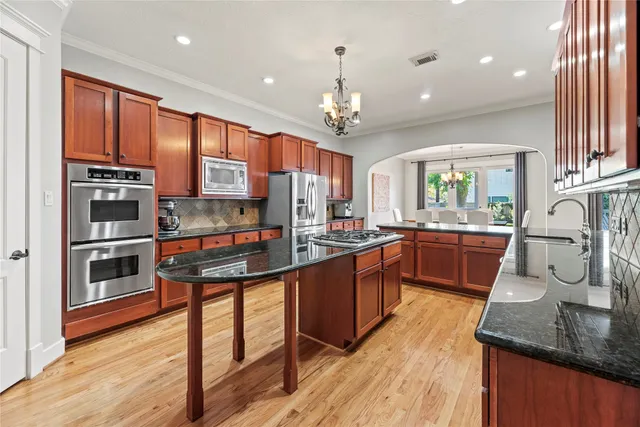 a living room with furniture fireplace and a large window