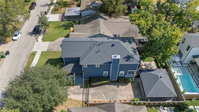 an aerial view of multiple houses with yard