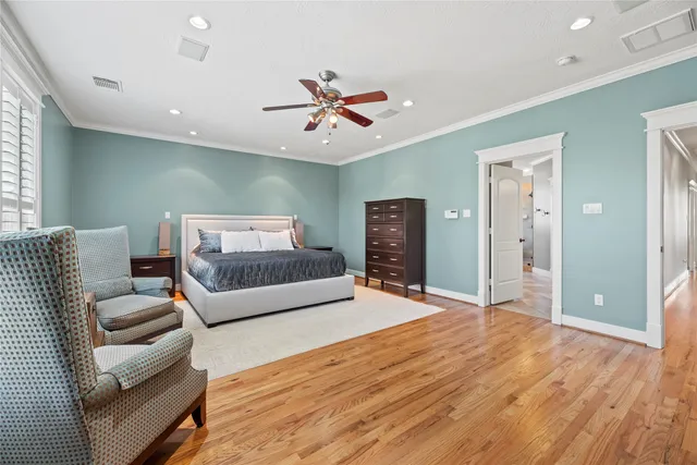 a kitchen with stainless steel appliances kitchen island granite countertop a stove refrigerator and cabinets