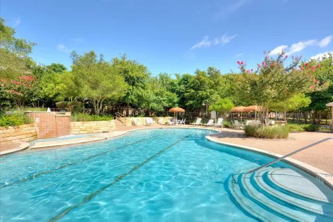 a view of swimming pool with a yard