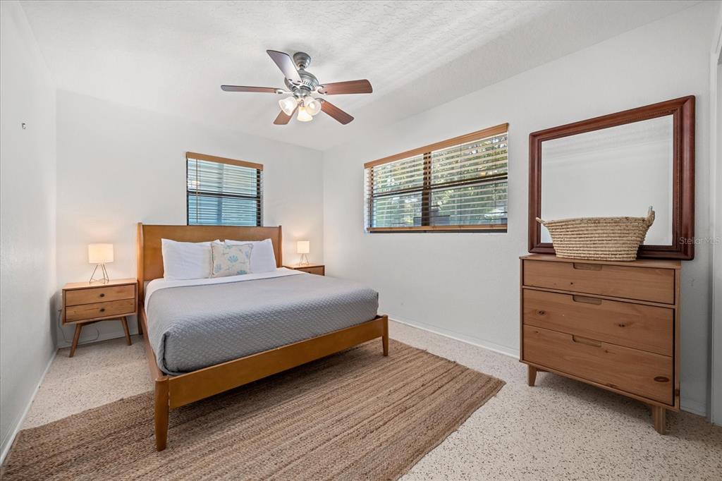 936 Santa Cruz Road Cocoa Beach, FL 32931 - Photo 13 of 45 a bedroom with a bed and a dresser