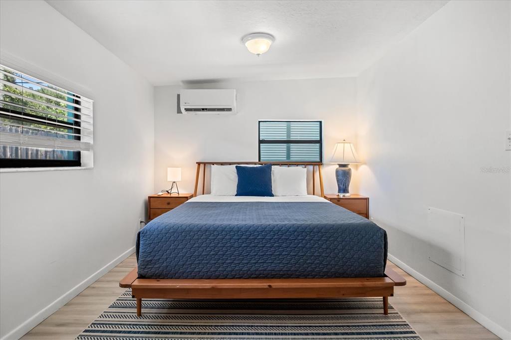 936 Santa Cruz Road Cocoa Beach, FL 32931 - Photo 18 of 45 a bedroom with a bed and painting on the wall