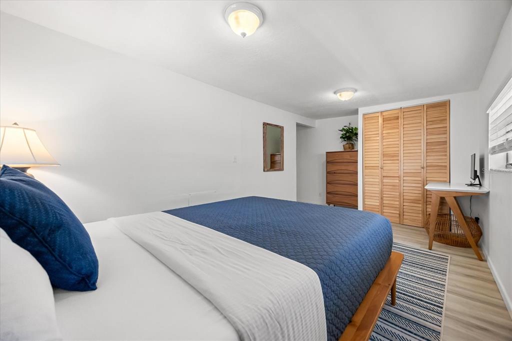 936 Santa Cruz Road Cocoa Beach, FL 32931 - Photo 19 of 45 a bedroom with a bed and wooden floor