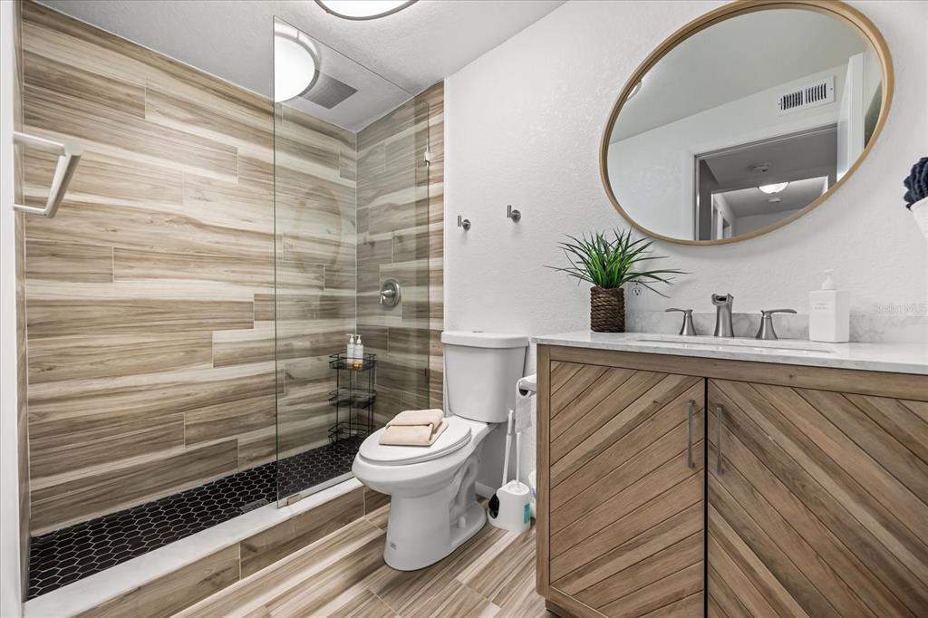 936 Santa Cruz Road Cocoa Beach, FL 32931 - Photo 20 of 45 a bathroom with a sink and a mirror