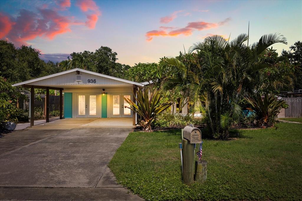 936 Santa Cruz Road Cocoa Beach, FL 32931 - Photo 2 of 45 a front view of a house with a yard