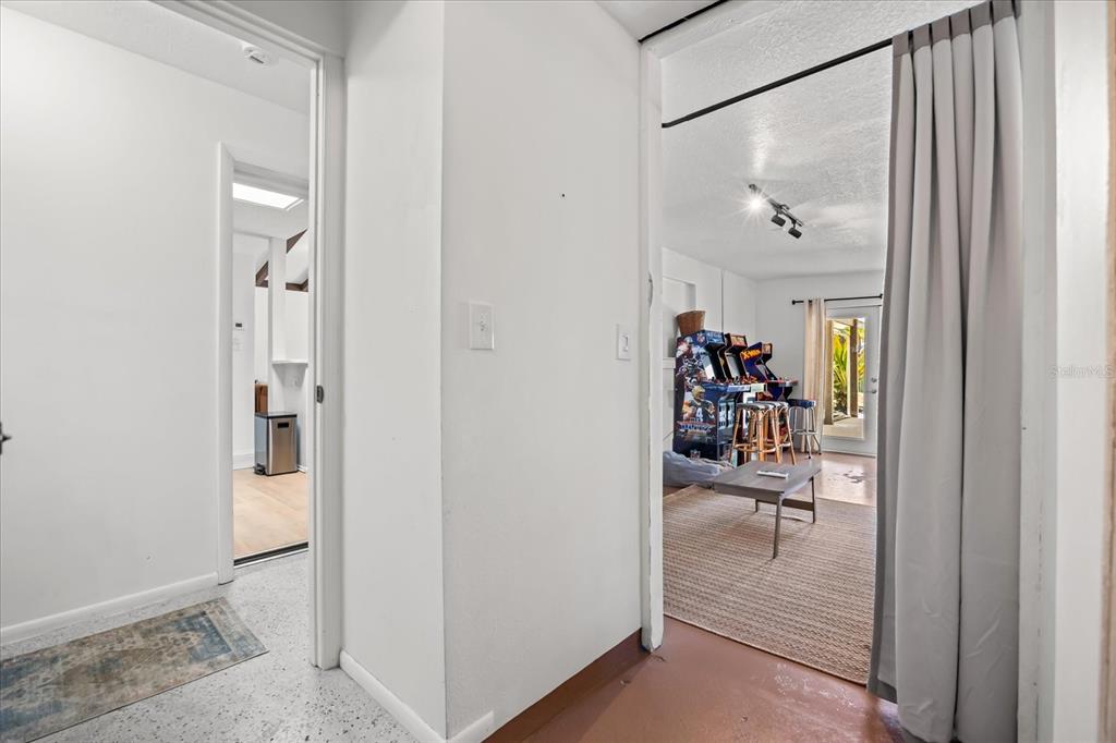 936 Santa Cruz Road Cocoa Beach, FL 32931 - Photo 22 of 45 a view of a hallway view with wooden floor and dining room