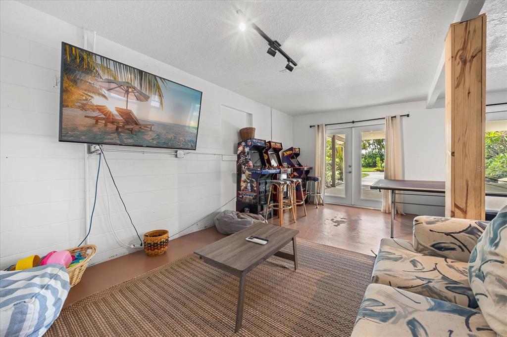 936 Santa Cruz Road Cocoa Beach, FL 32931 - Photo 24 of 45 a bed room with a bed and a flat screen tv