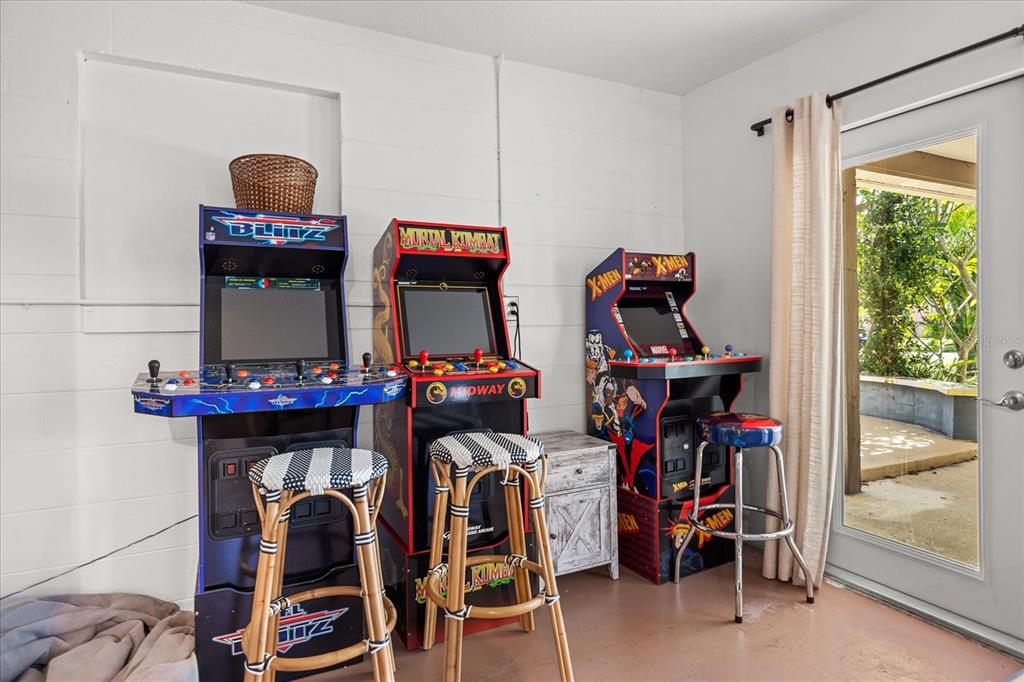 936 Santa Cruz Road Cocoa Beach, FL 32931 - Photo 25 of 45 a room with gym equipment and a mirror