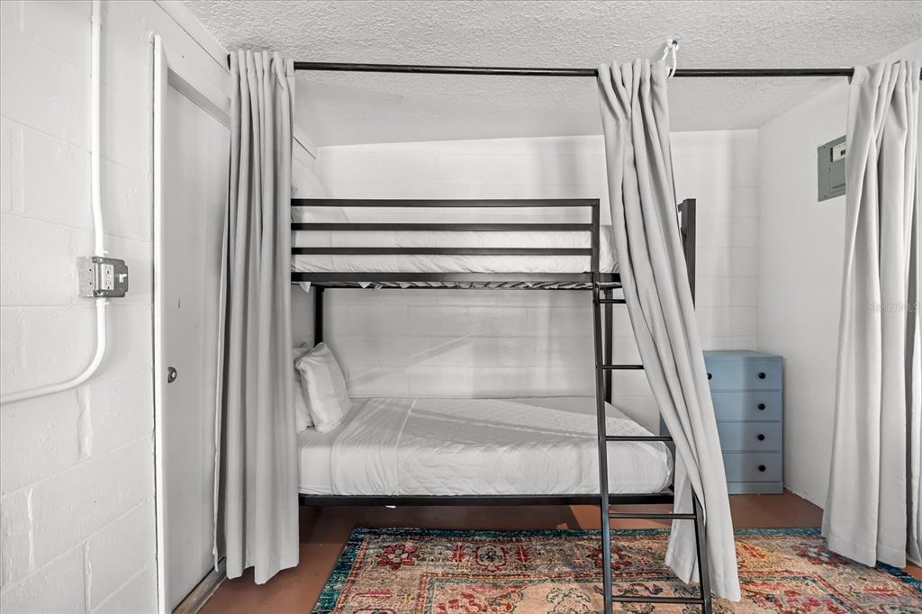 936 Santa Cruz Road Cocoa Beach, FL 32931 - Photo 26 of 45 a bathroom with a glass shower door