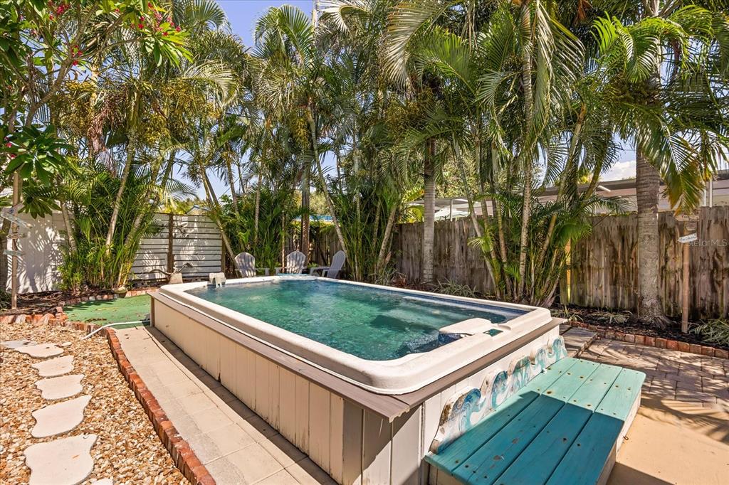 936 Santa Cruz Road Cocoa Beach, FL 32931 - Photo 31 of 45 a view of a backyard with swimming pool and sitting area