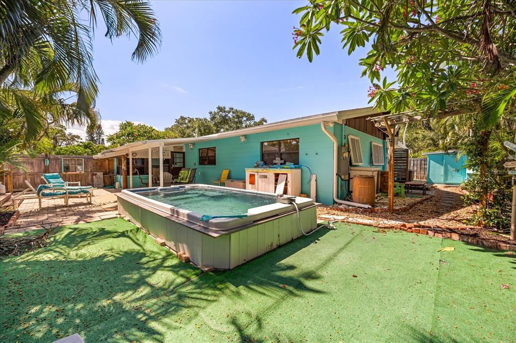 936 Santa Cruz Road Cocoa Beach, FL 32931 - Photo 32 of 45 a view of a house with pool and chairs