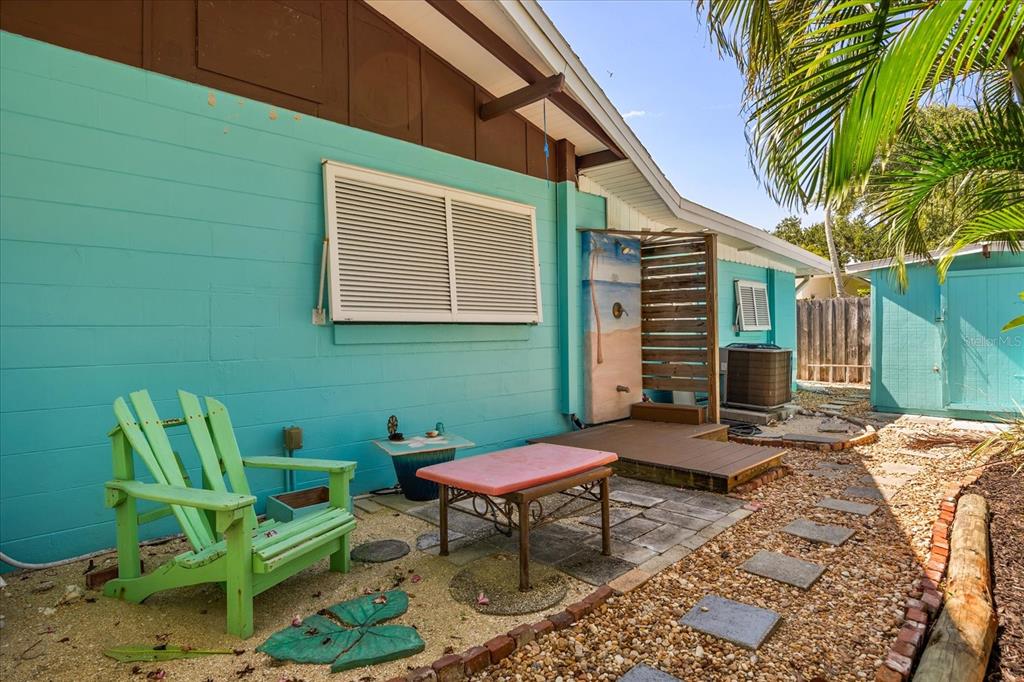 936 Santa Cruz Road Cocoa Beach, FL 32931 - Photo 33 of 45 a backyard of a house with outdoor seating