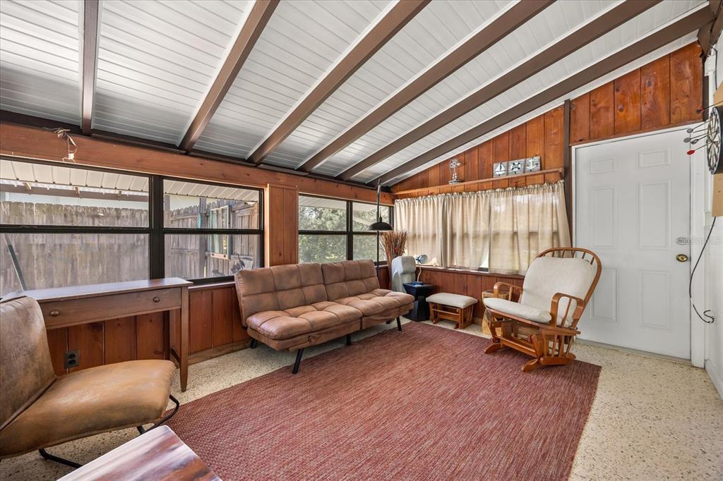 936 Santa Cruz Road Cocoa Beach, FL 32931 - Photo 34 of 45 a living room with furniture and a large window