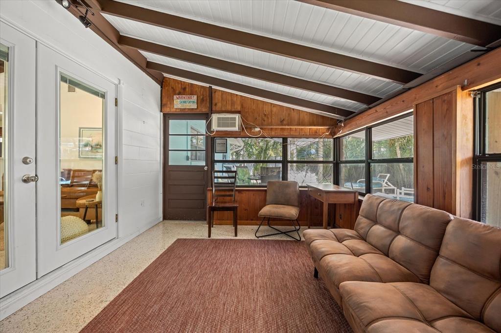 936 Santa Cruz Road Cocoa Beach, FL 32931 - Photo 35 of 45 a living room with furniture and a floor to ceiling window
