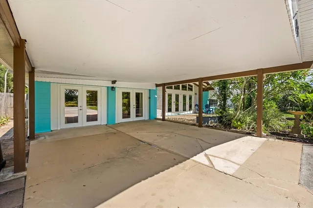 a view of a house with backyard and porch