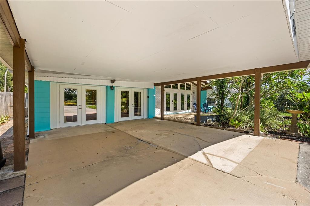 936 Santa Cruz Road Cocoa Beach, FL 32931 - Photo 36 of 45 a view of a house with backyard and porch