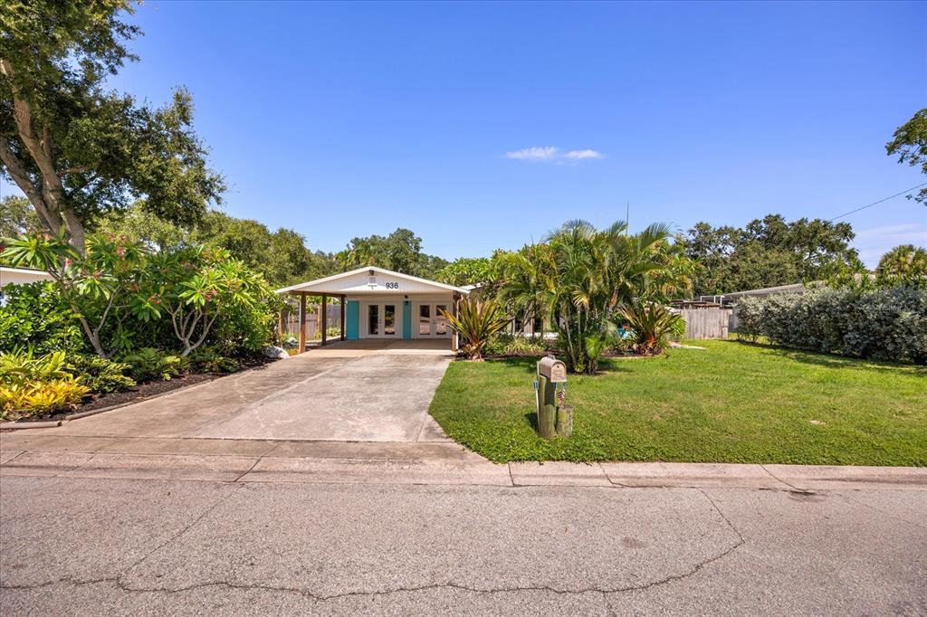 936 Santa Cruz Road Cocoa Beach, FL 32931 - Photo 40 of 45 a front view of a house with a yard