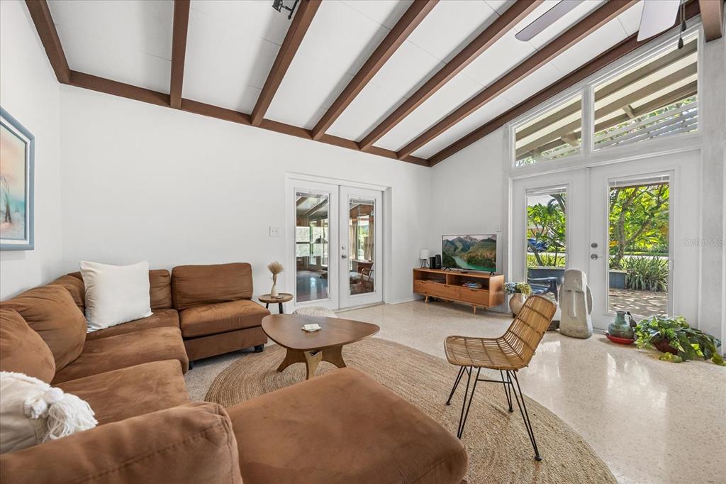 936 Santa Cruz Road Cocoa Beach, FL 32931 - Photo 4 of 45 a living room with furniture and a large window