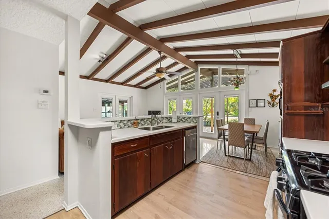 a kitchen with stainless steel appliances granite countertop a stove and a refrigerator