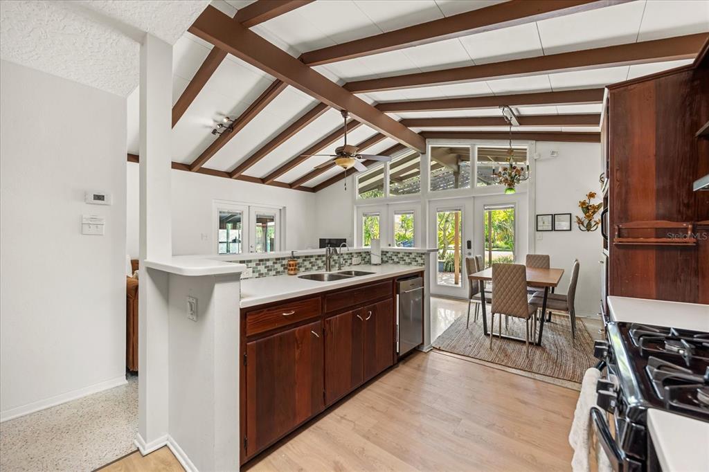 936 Santa Cruz Road Cocoa Beach, FL 32931 - Photo 8 of 45 a kitchen with stainless steel appliances granite countertop a stove and a refrigerator