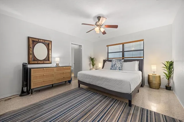 a bedroom with a bed and window