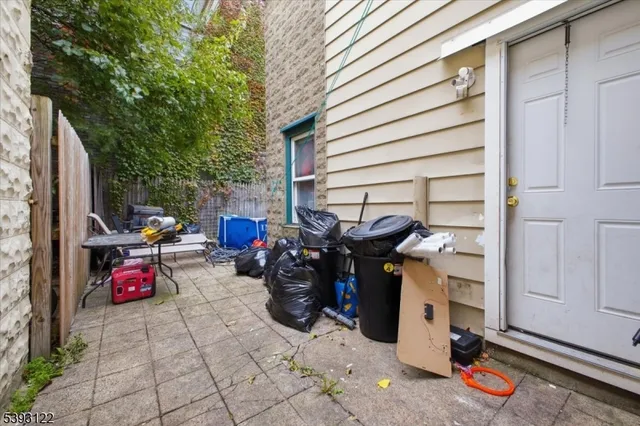 a view of a patio with storage and utility room